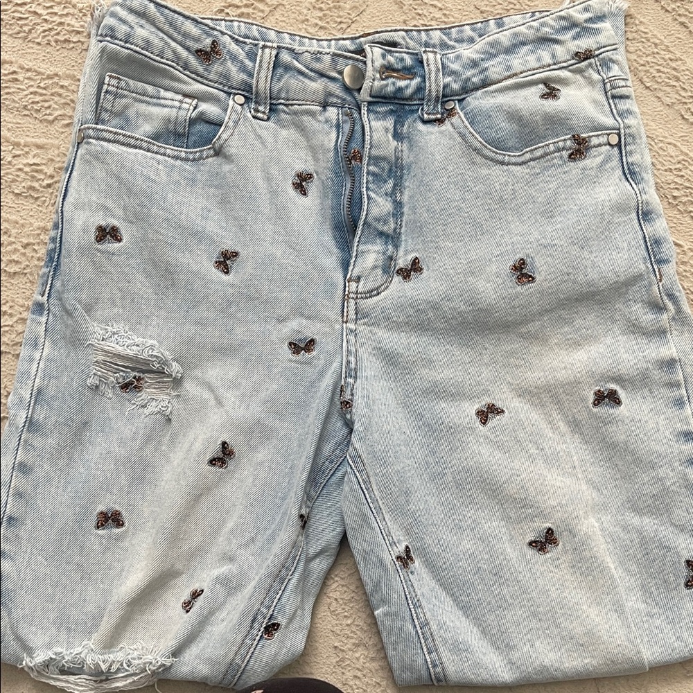 Material Girl light blue butterfly embroidered ripped jeans